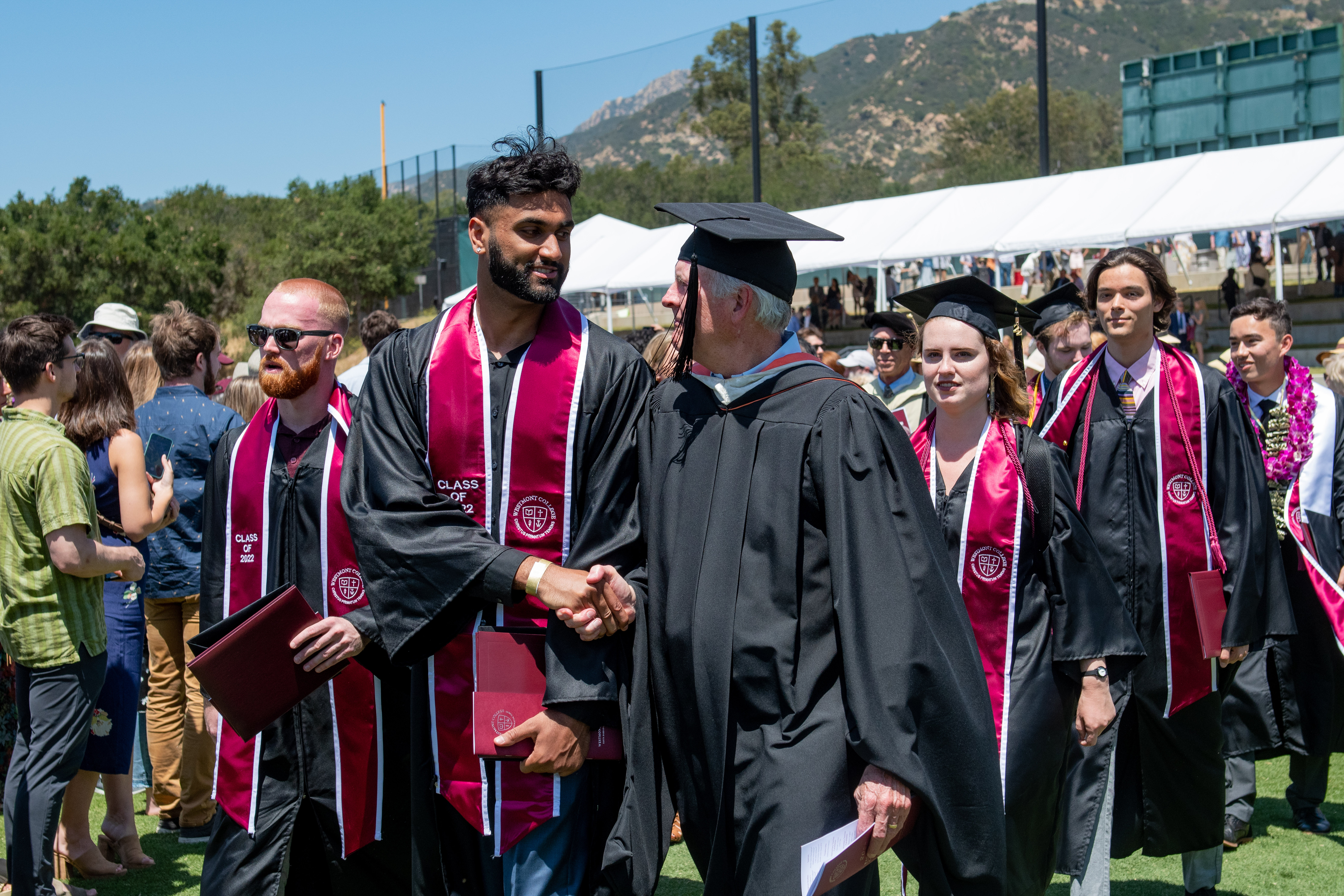 westmont professor and student shaking hands at commencement