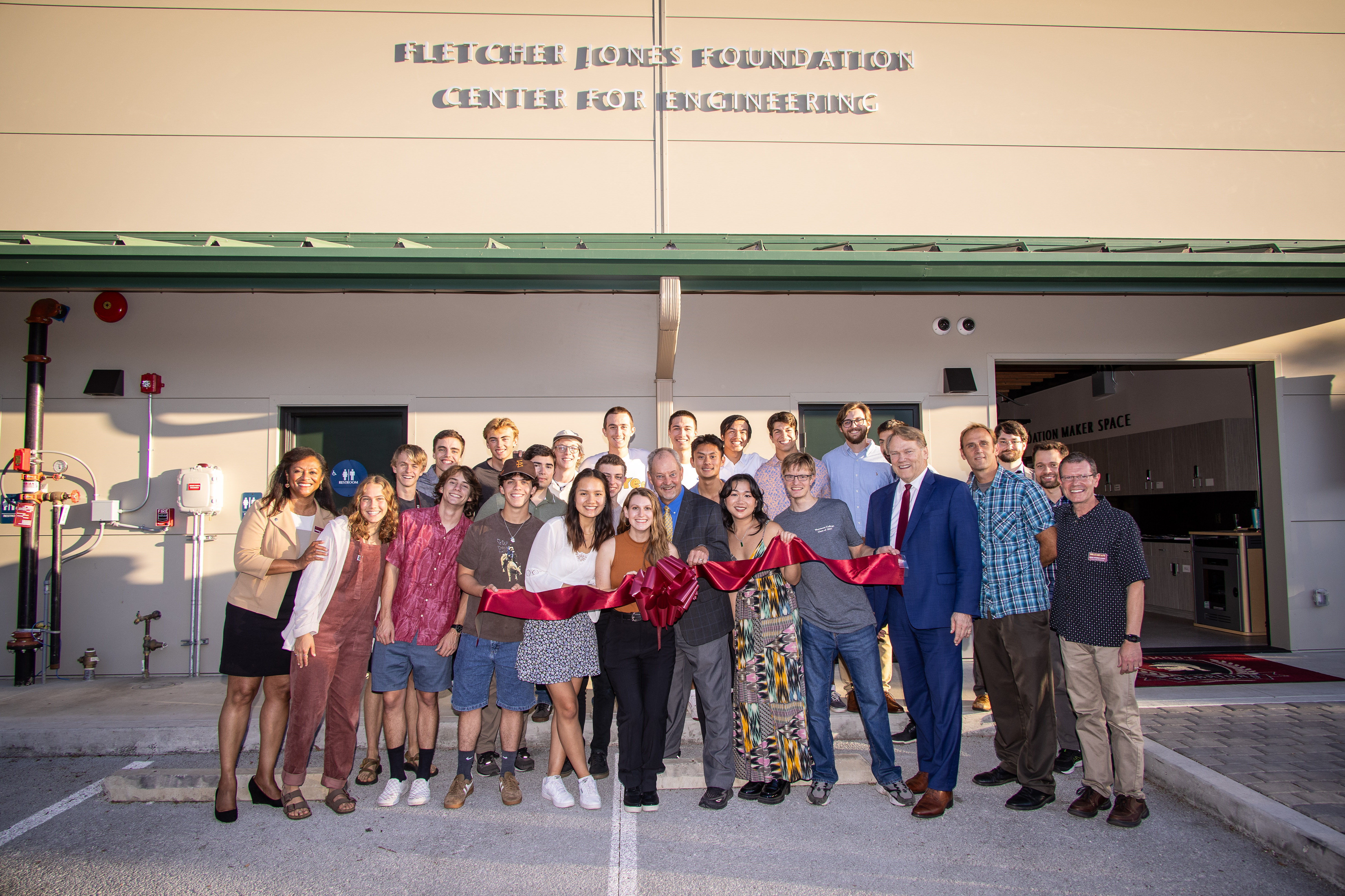 ribbon cutting engineering building with students