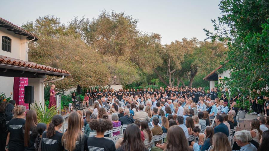 Kirsten Moore speaks at the 50 years of women in athletics event