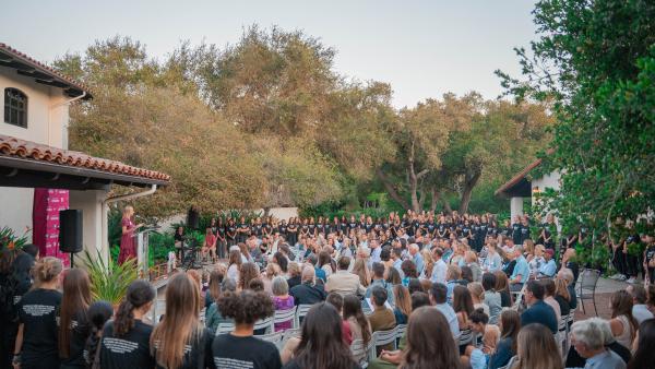 Kirsten Moore speaks at the 50 years of women in athletics event